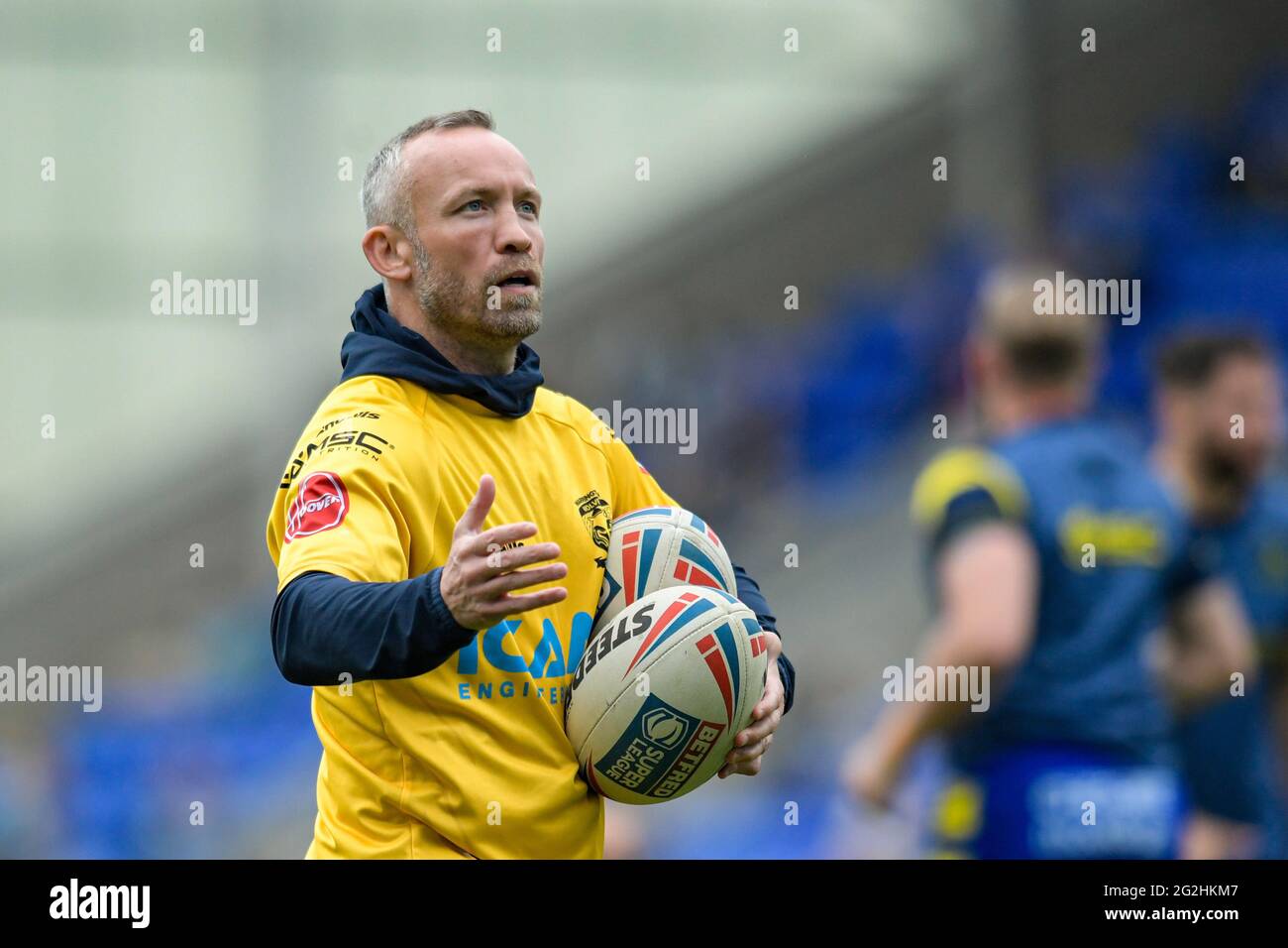 Andrew Henderson assistant coach of Warrington Wolves leads the warm up Stock Photo