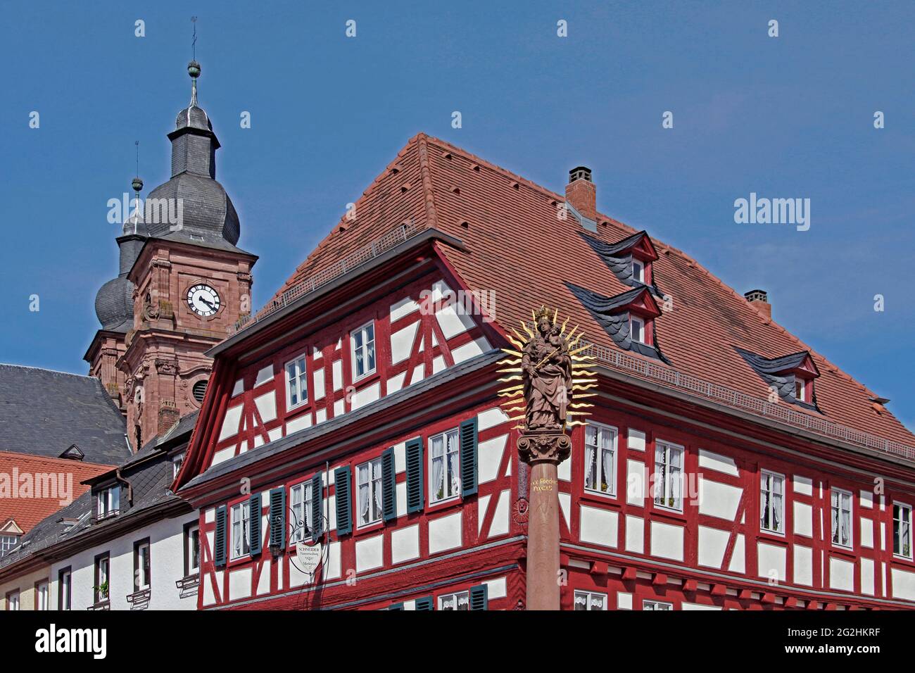 historic old town, market square, towers of the Catholic parish church St. Gangolf, half-timbered house, Marian column, baroque town Amorbach, Odenwald, Bavaria, Germany Stock Photo