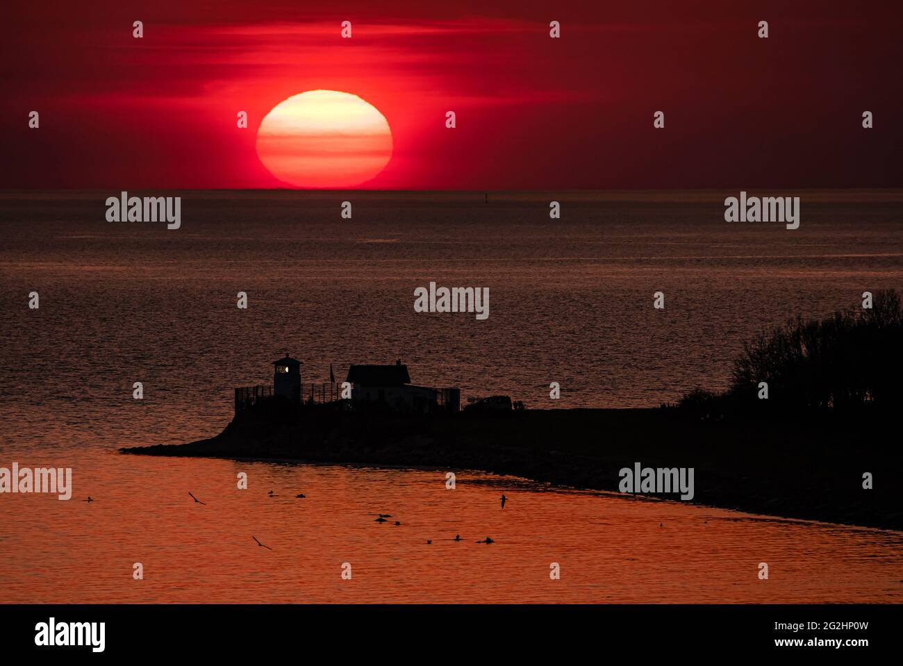 Sunset at the Strukkamphuk beacon. Location, Fehmahrn Island, Baltic Sea Stock Photo