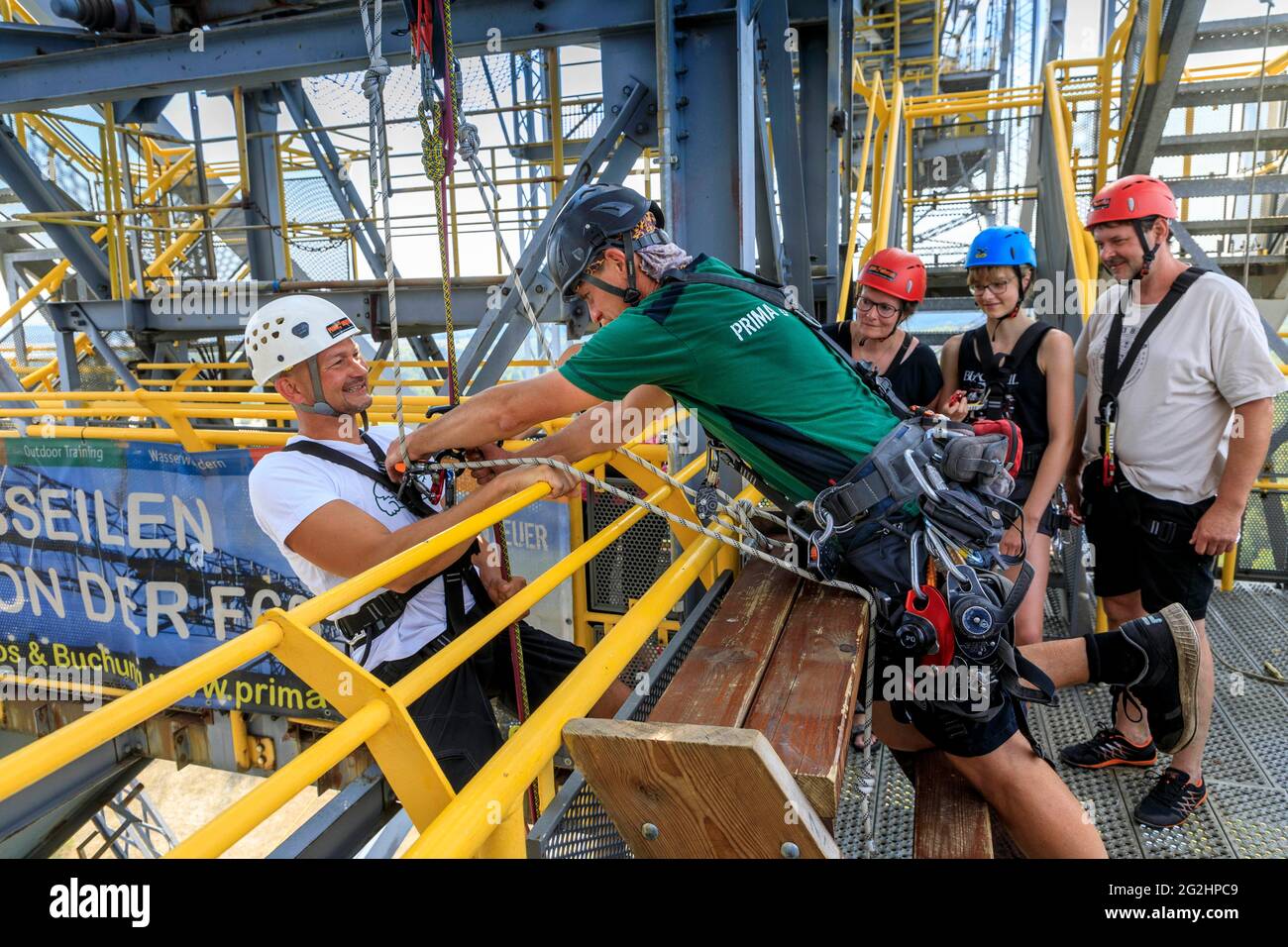 Test of courage at lofty heights, abseiling from 60 meters from the conveyor bridge F60 Stock Photo