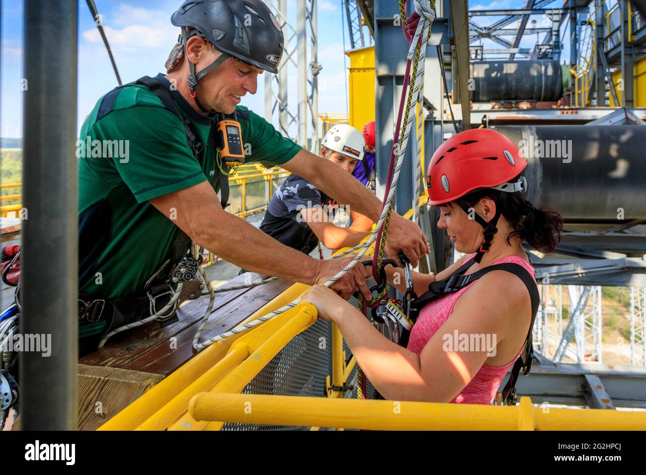 Test of courage at lofty heights, abseiling from 60 meters from the conveyor bridge F60 Stock Photo