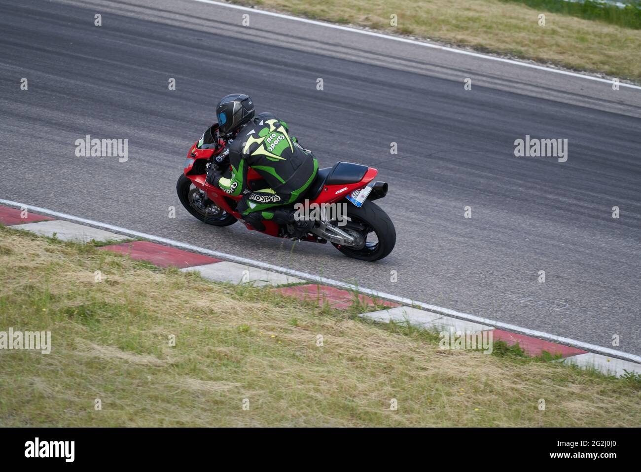 11-05-2020 Kaunas, Lithuania Motorcyclist at sport bike rides by empty asphalt road. sport bike. MotoGP race. Superbikes. Motorbikes racing. Stock Photo