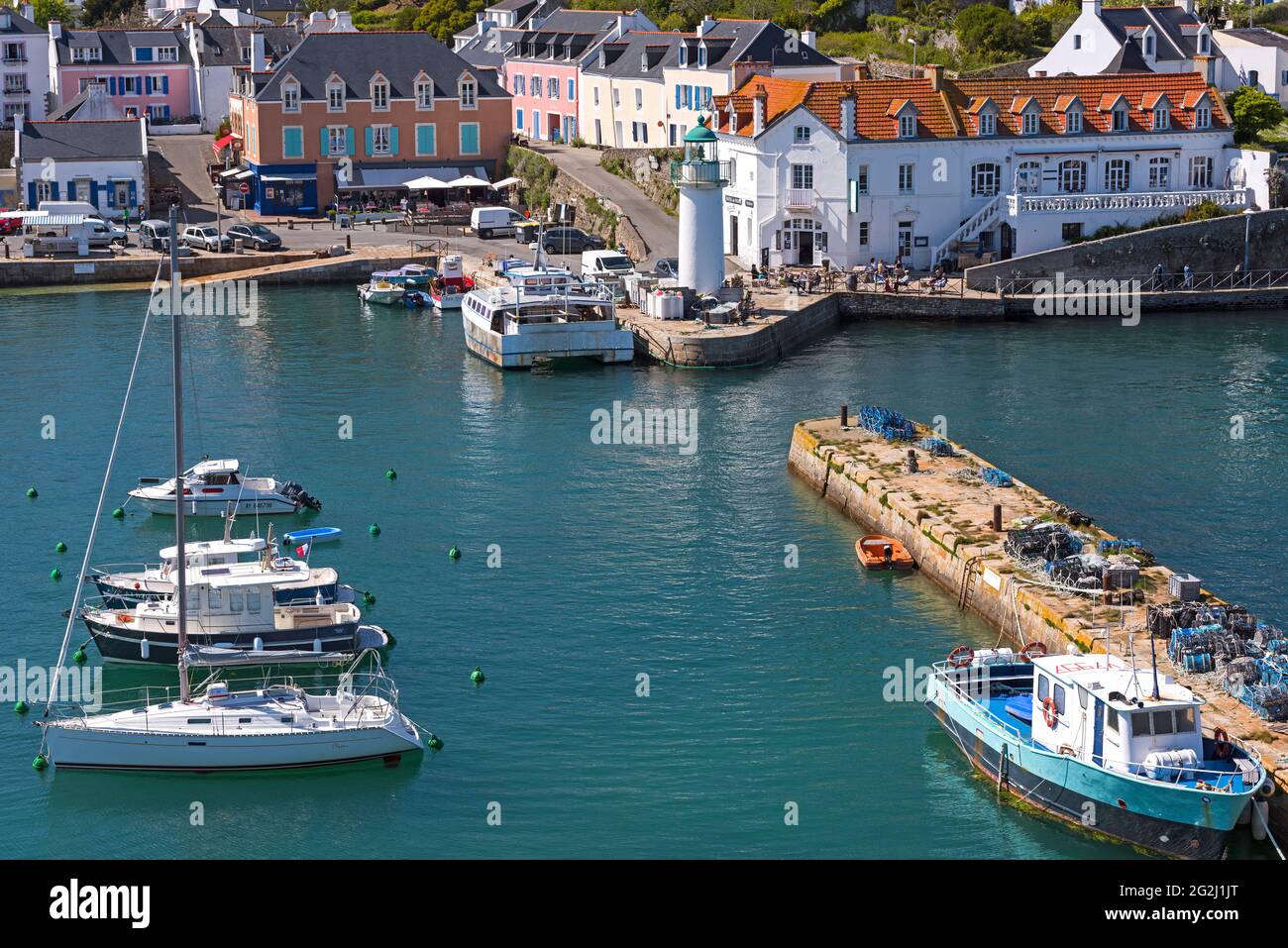 View of the harbor, the lighthouse and the colorful houses of Sauzon, Belle-Ile-en-Mer, France, Brittany, Morbihan department Stock Photo