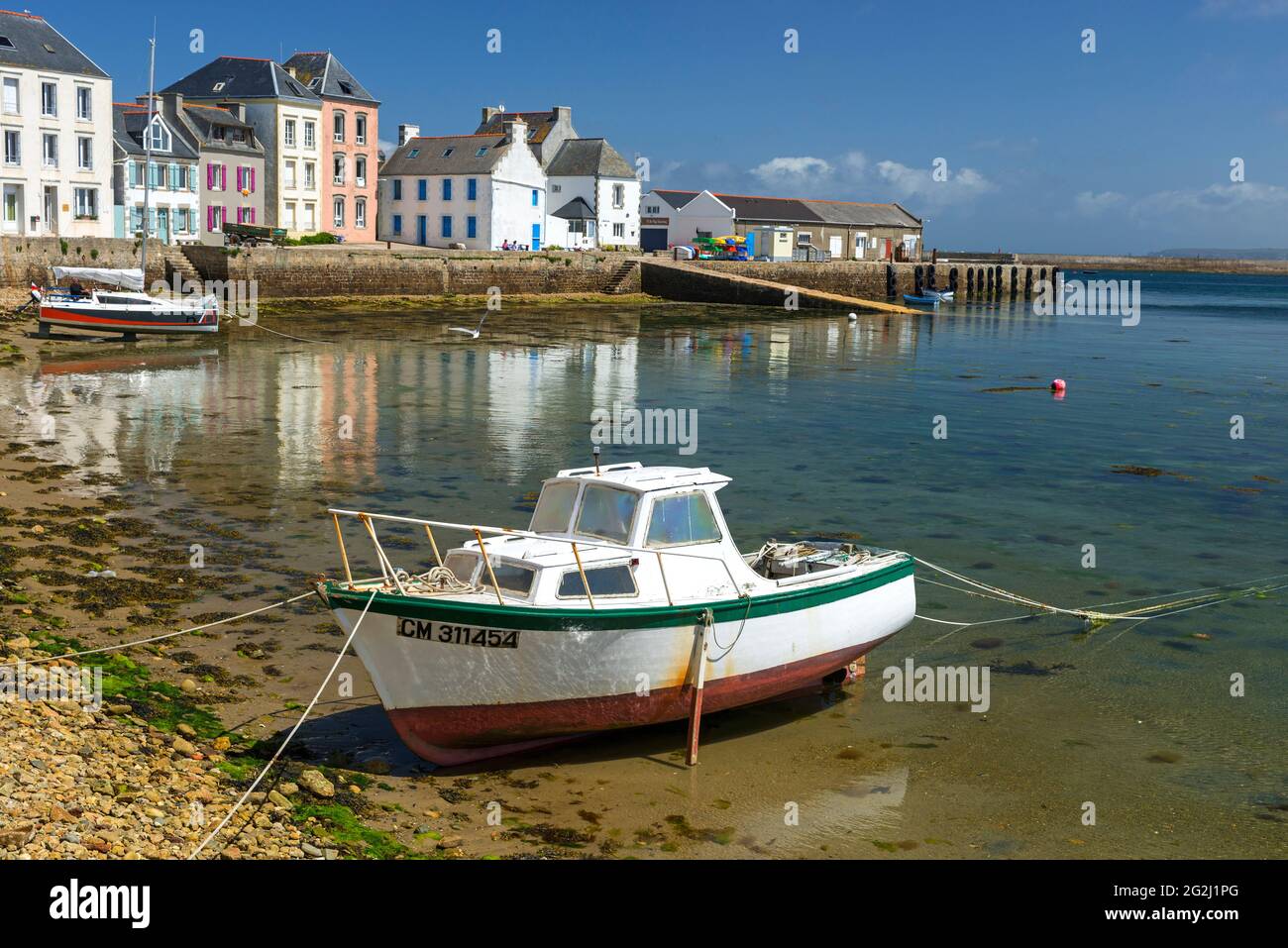 Île de Sein, colorful houses and boats in the harbor, France, Brittany, Finistère department Stock Photo