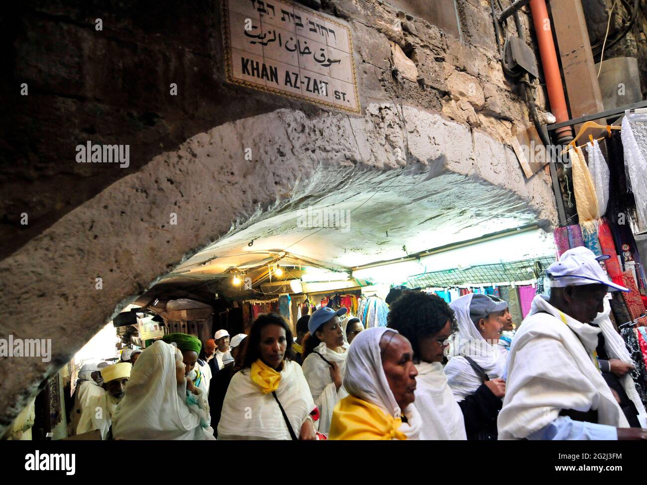 Christian pilgrims walking on the Via Dolorosa at the Khan El Zeit st. in the old city of Jerusalem. Stock Photo