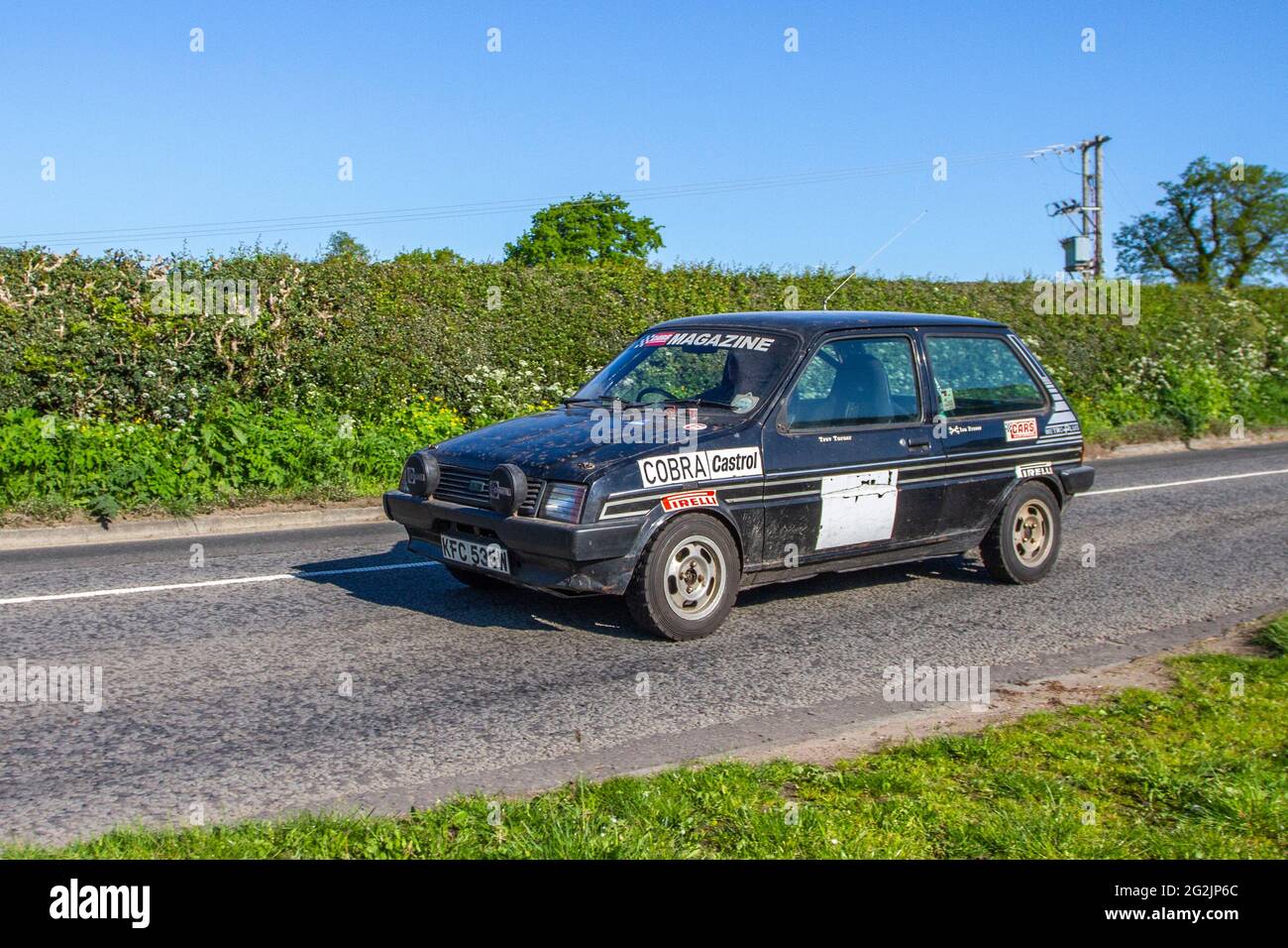 Cobra Castrol, 1980 80s Austin Metro Hls black 1275cc petrol hatchback, en-route to Capesthorne Hall classic May car show, Cheshire, UK Stock Photo