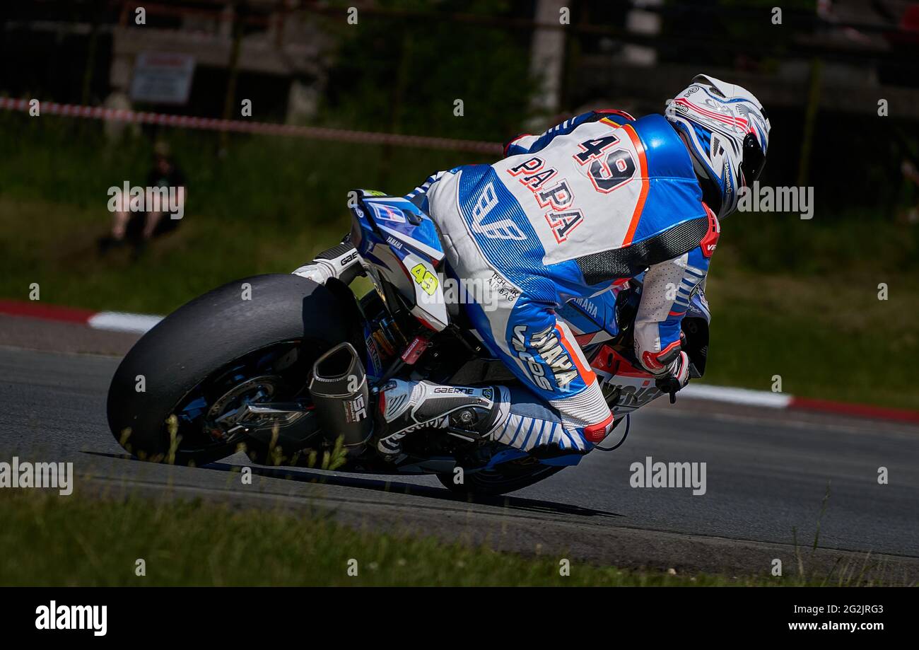 Riga, Latvia, 12-06-2021 Motorcycle rider takes corner. View from back.  MotoGP rider Stock Photo - Alamy