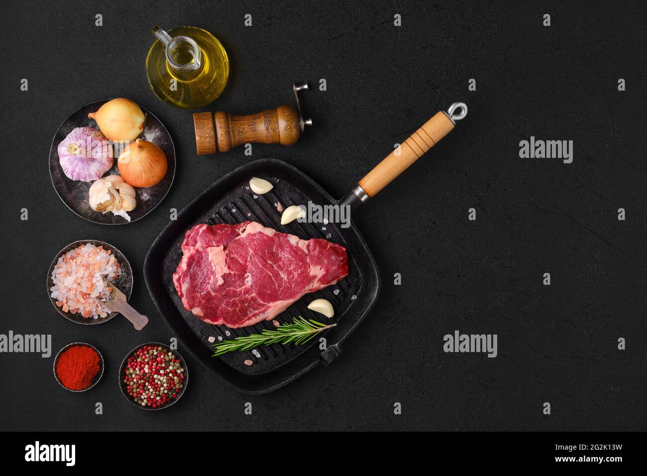 Overhead view of raw ribeye steak, premium beef boneless meat on cast