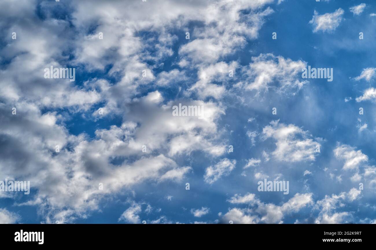 White and gray clouds in a blue sky. Nature Cloudscape Stock Photo - Alamy