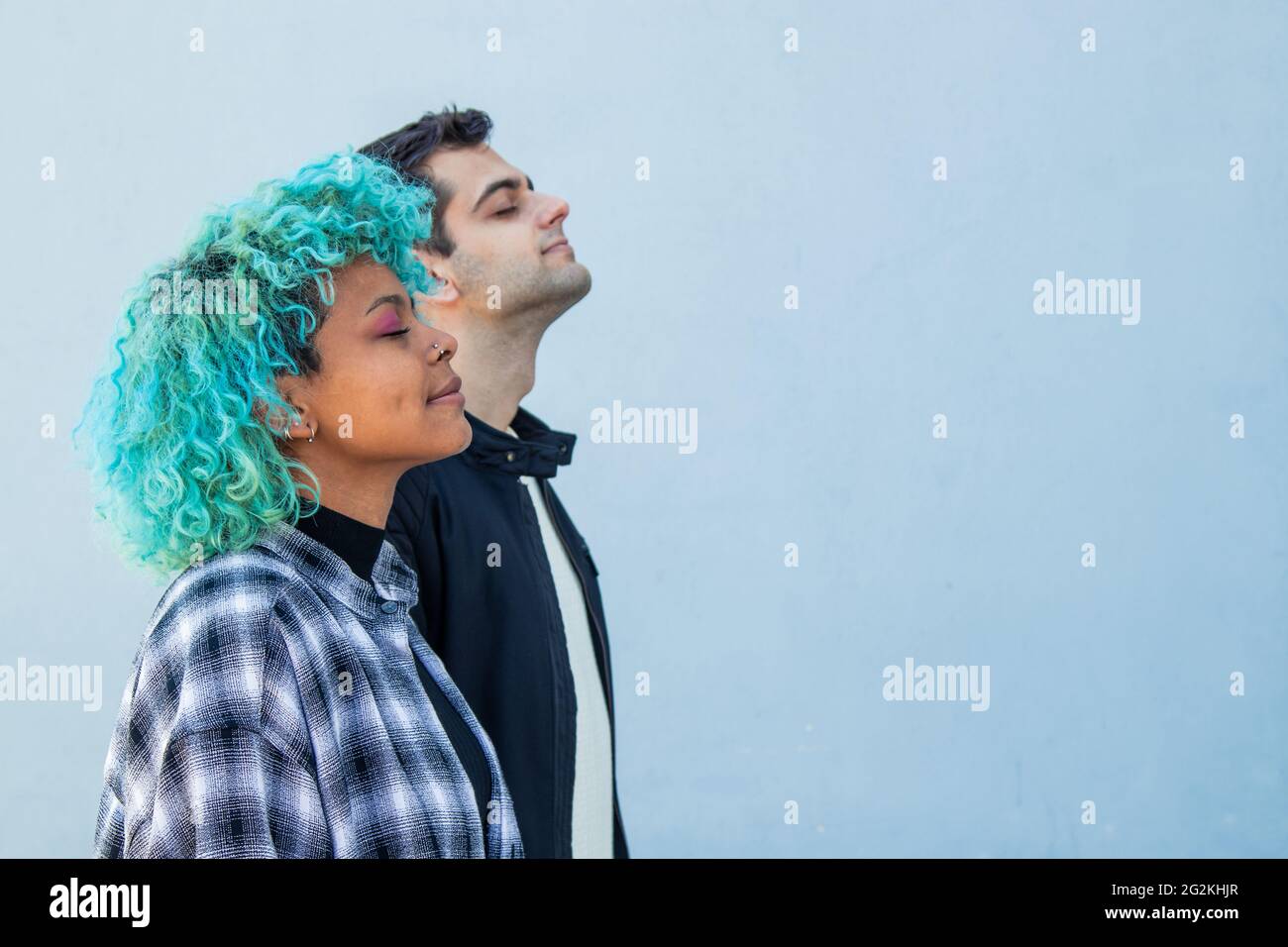 portrait of concentrated multiethnic couple breathing Stock Photo