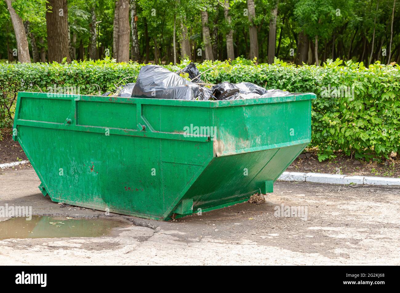 Big metal garbage container for waste at the city park Stock Photo