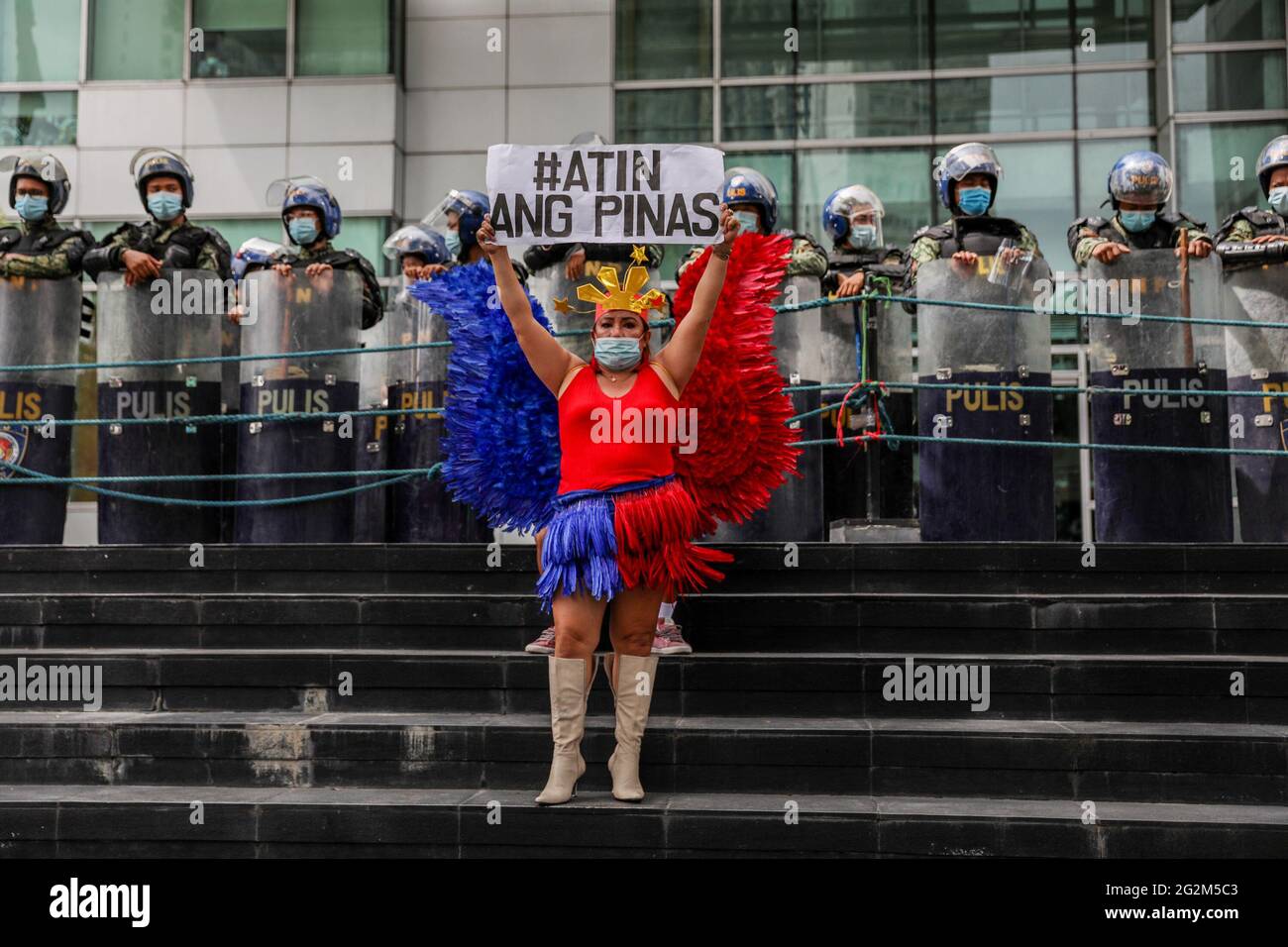 Metro Manila Philippines 12th June 21 An Activist Wearing A Costume Bearing The Colors Of The Philippine Flag Stands In Front Of The Chinese Consulate During A Protest To Mark Independence Day Metro Manila Philippines 12th June 21 An Activist Wearing A Costume Bearing The Colors Of The Philippine Flag Stands In Front Of The Chinese Consulate During A Protest To Mark Independence Day