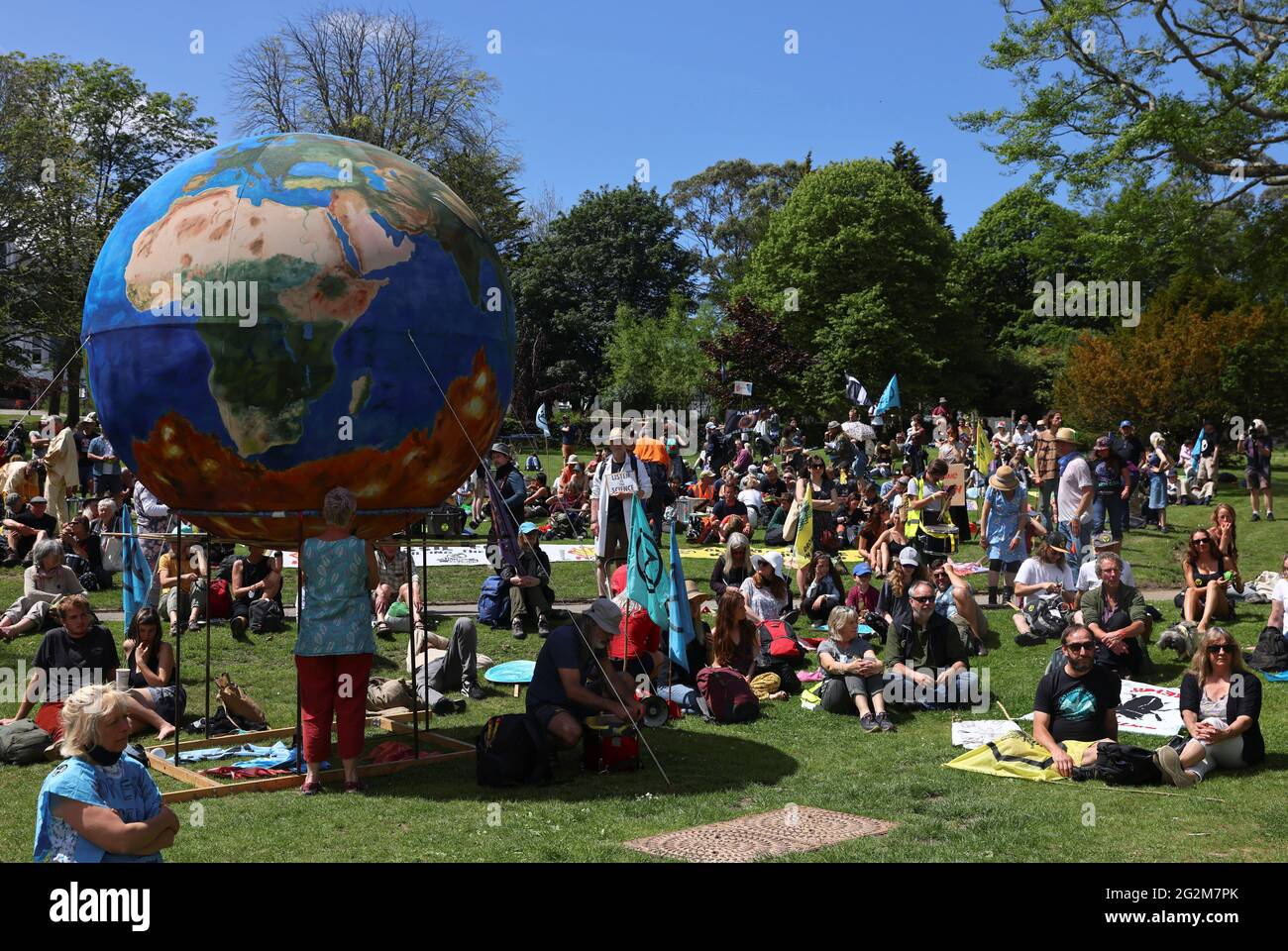 People gather at an Extinction Rebellion demonstration at Kimberley Park in Falmouth, during the G7 summit in Cornwall, Britain, June 12, 2021. REUTERS/Tom Nicholson Stock Photo