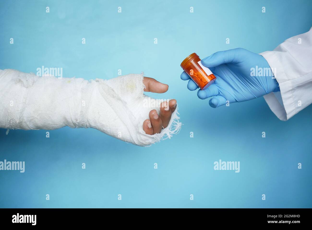 doctor medicine for injured painful hand with bandage Stock