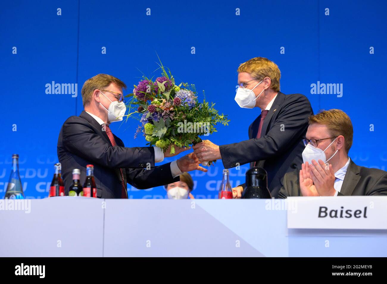 12 June 21 Schleswig Holstein Neumunster Johann Wadephul Cdu L Top Candidate Of The Northern Cdu For The Bundestag Election Receives A Bouquet Of Flowers From His Party Colleague Daniel Gunther Cdu M