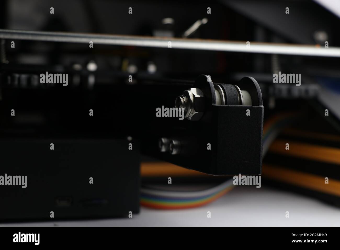 Bed upon which 3D printing process takes place with visible heating bed and bunch of wires of background Stock Photo