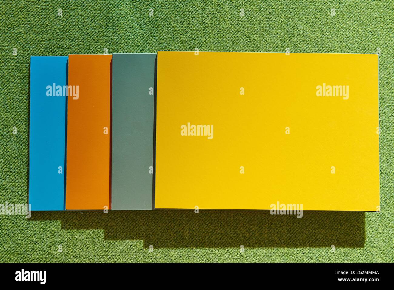 four colored rectangular texture tiles on a green background Stock ...