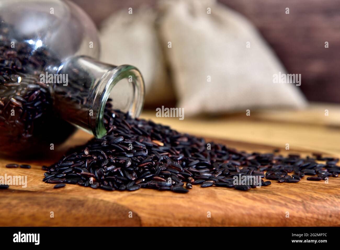 Organic black rice in a glass bottle Stock Photo