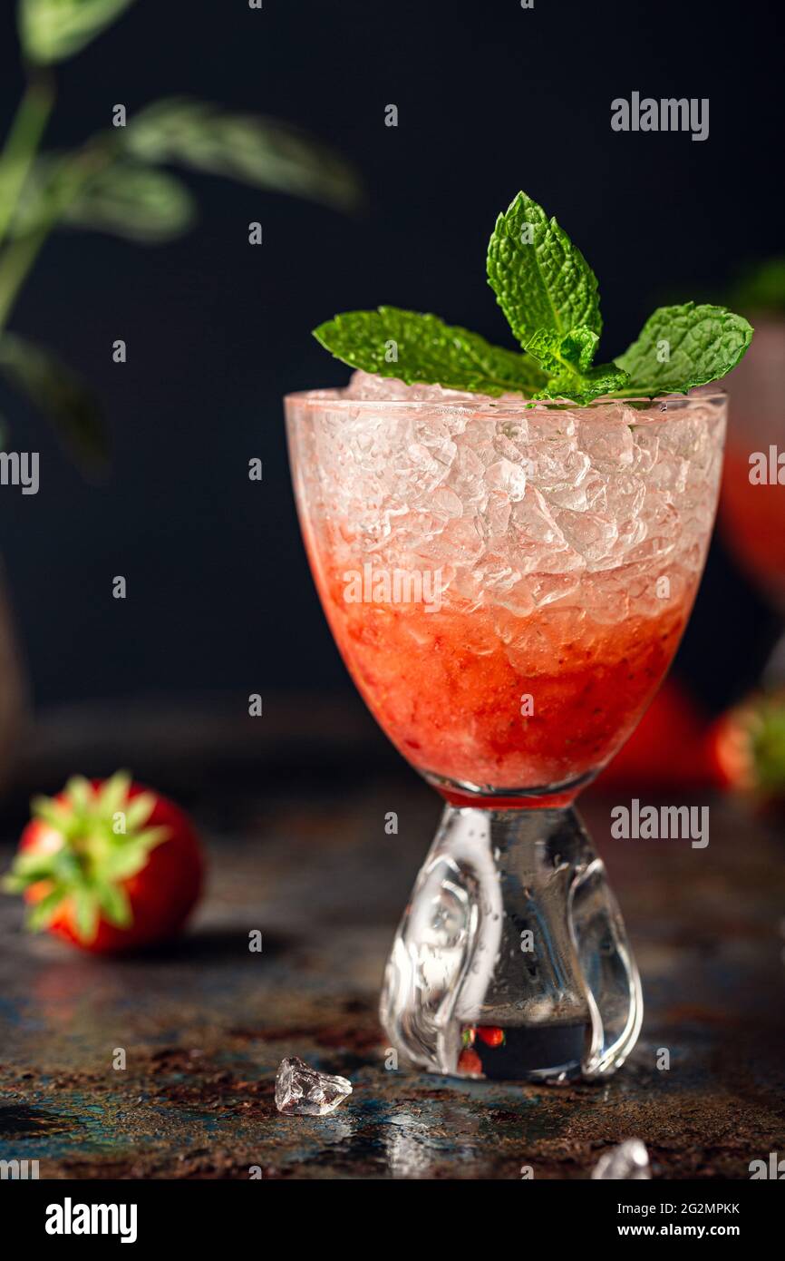 Fresh cocktail with crushed ice, strawberry and mint Stock Photo