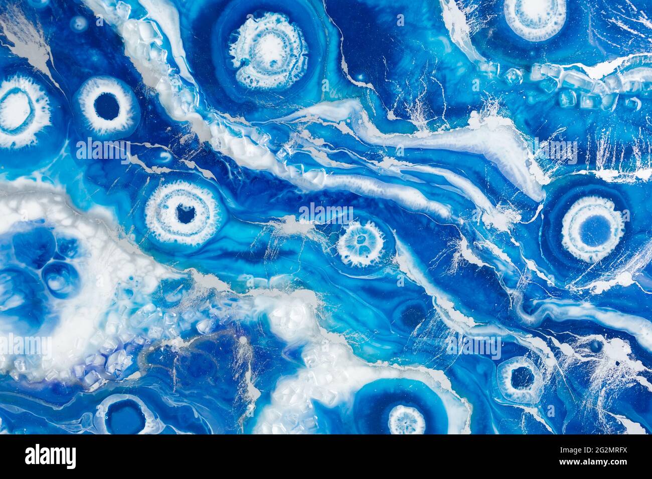 Epoxy resin art background. Resin art with blue and white colors Stock
