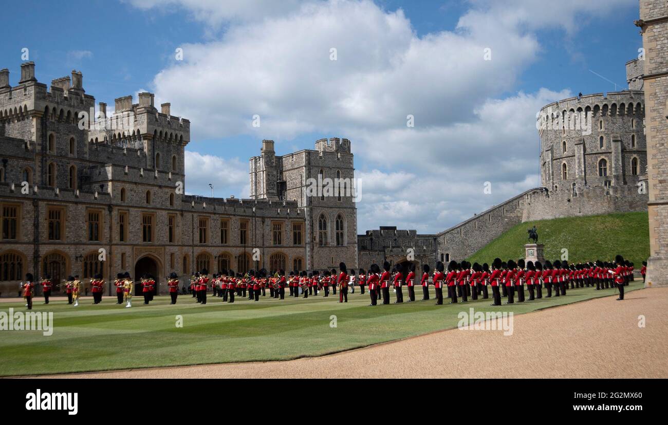 Guardsmen stand in formation as they take part in a ceremony at Windsor Castle in Berkshire to mark the official birthday of Queen Elizabeth II. Picture date: Saturday June 12, 2021. Stock Photo