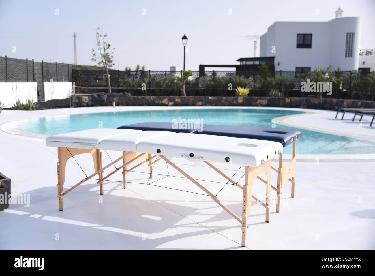 Portable massage table on the poolside Stock Photo