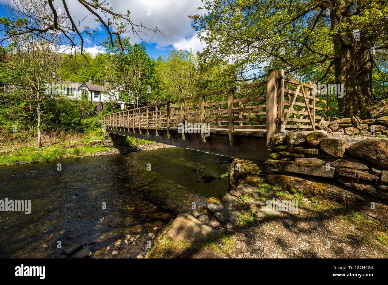 River Rothery The footbridge over the River Rothay at Rydal Water in the Lake ...