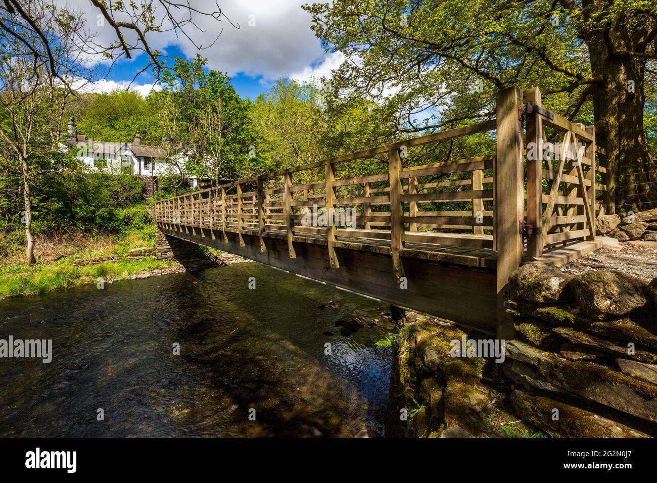 River Rothery The footbridge over the River Rothay at Rydal Water in the Lake ...