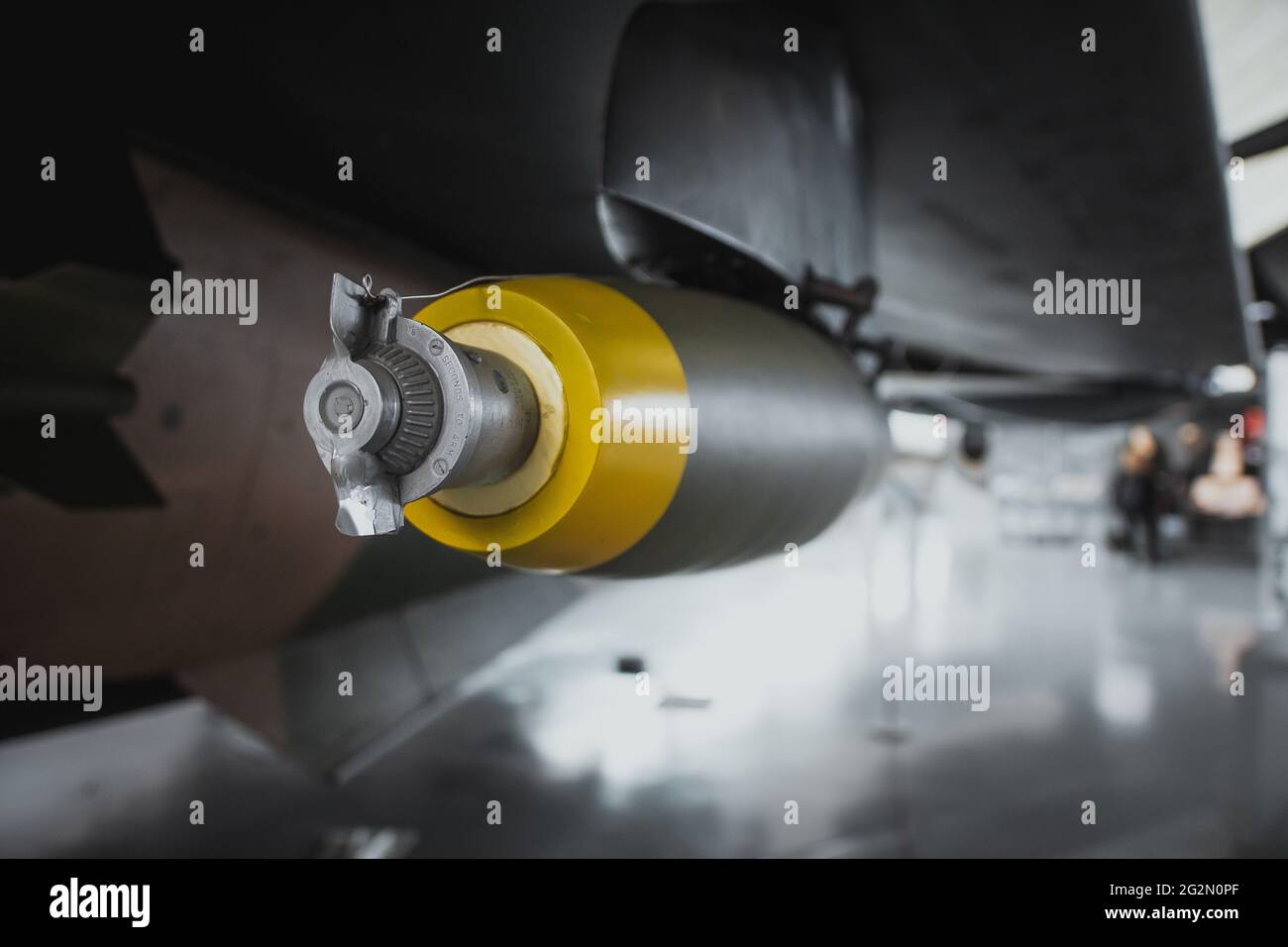 Close up view of an unguided bomb attached to a wing of a fighter