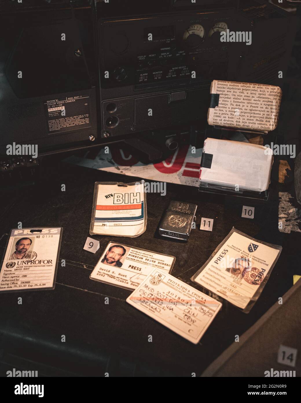 Duxford England May 2021 Exhibit of bosnian and serbian journalist identification papers from the yugoslav wars in the 90s Stock Photo