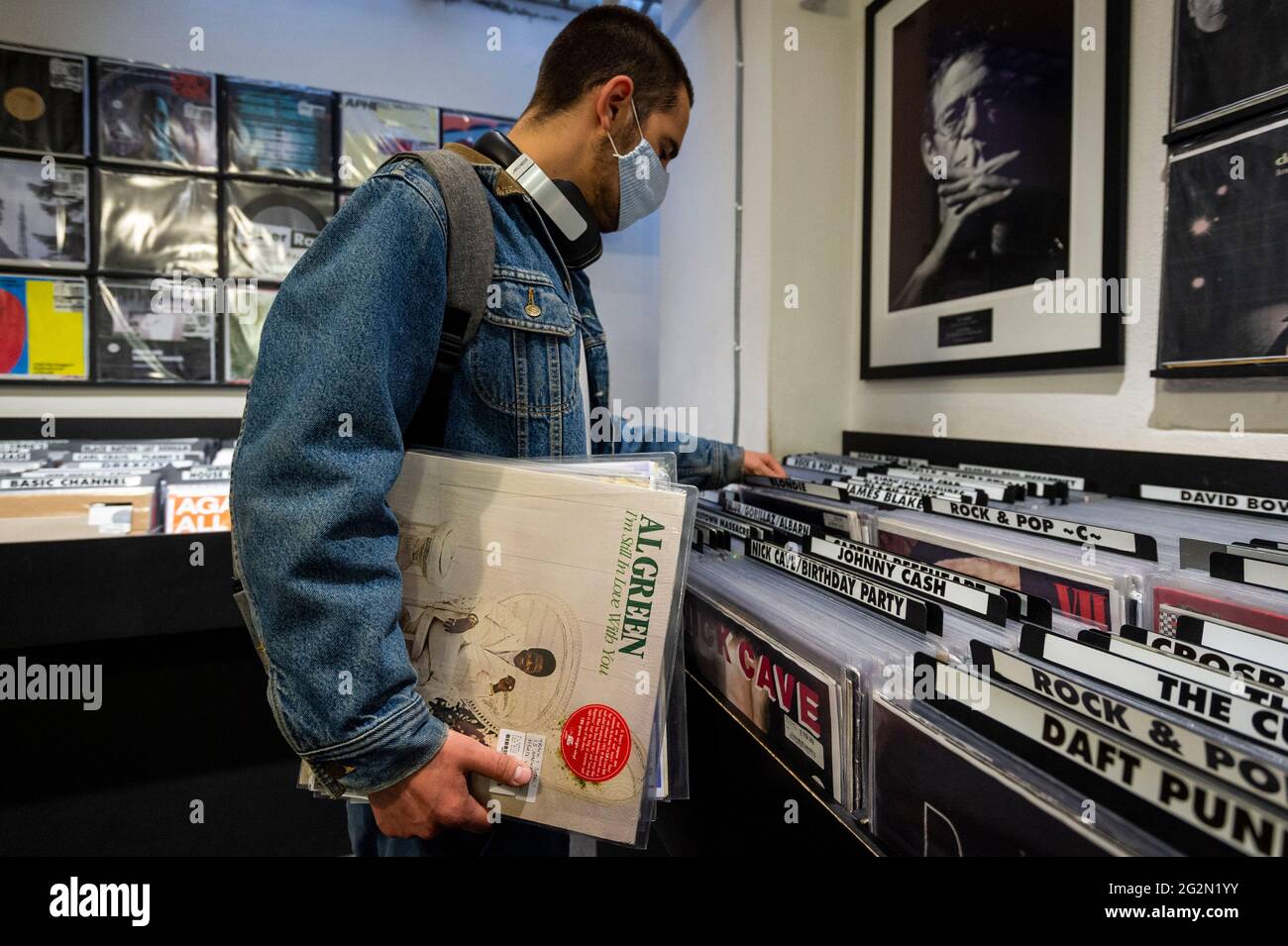 London, UK.  12 June 2021. A customer in Sister Ray Records in Soho on Record Store Day, where independent record shops worldwide celebrate music, including special vinyl releases made exclusively for the day. In the UK, vinyl sales have increased for the 13th consecutive year.  The BPI reported that nearly 5m records were sold in the 2020 in the UK as, with more time spent at home, music lovers had time to add to their collections. Credit: Stephen Chung / Alamy Live News Stock Photo