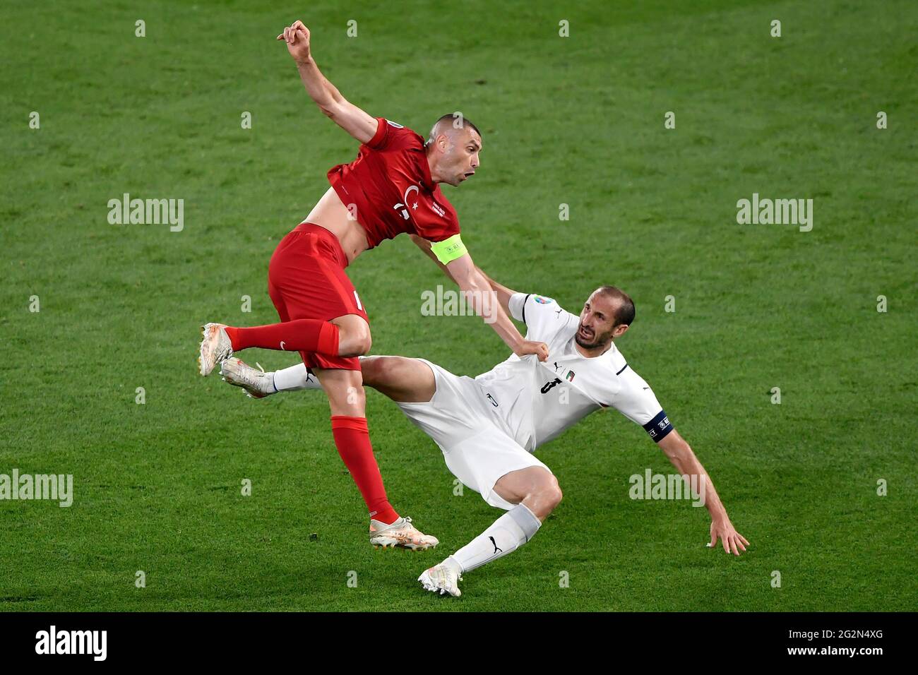 Roma, Italy. 11th June, 2021. Burak Yilmaz of Turkey and Giorgio Chiellini  of Italy compete for the ball during the Uefa Euro 2020 Group stage - Group  A football match between Turkey