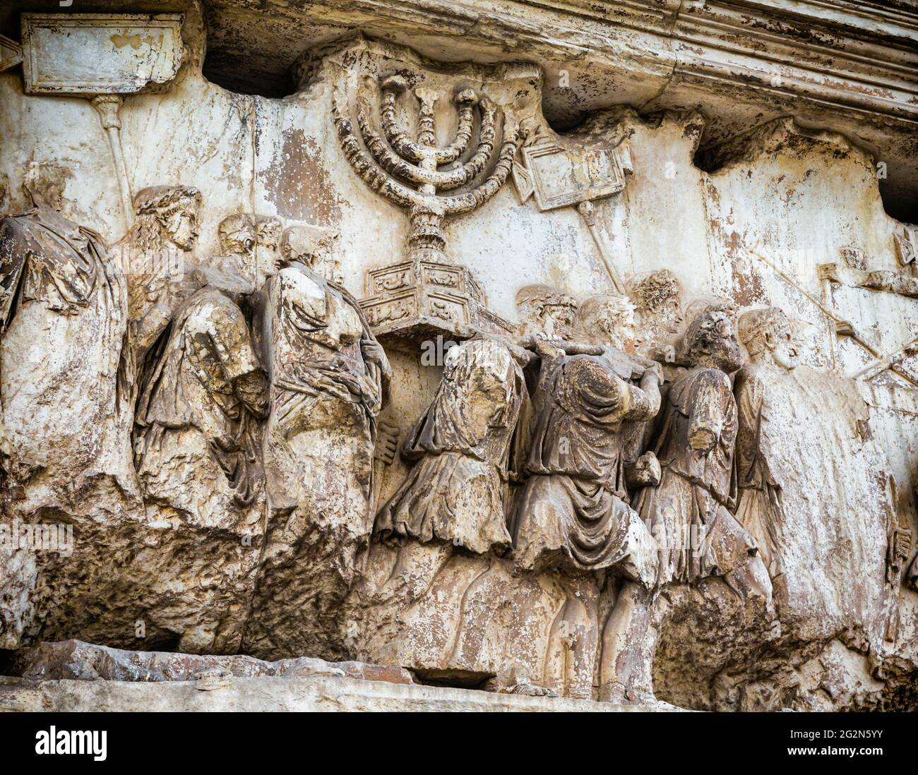 Rome, Italy.  The procession panel on the Arch of Titus in the Roman Forum.  The Arch was built after Titus's death to commemorate his conquest of Jud Stock Photo