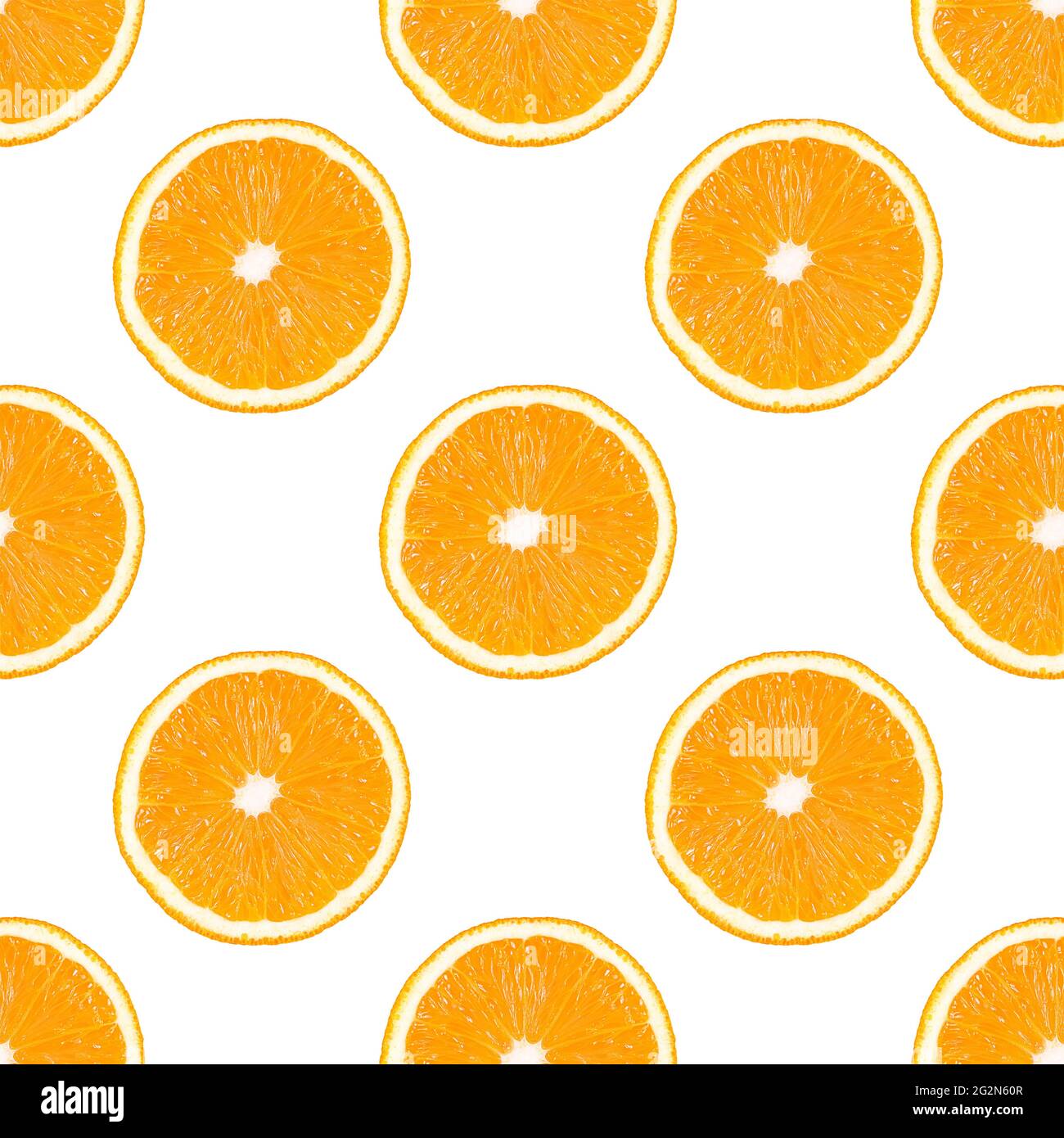 Seamless pattern made from orange fruit slice isolated on a white background. Stock Photo