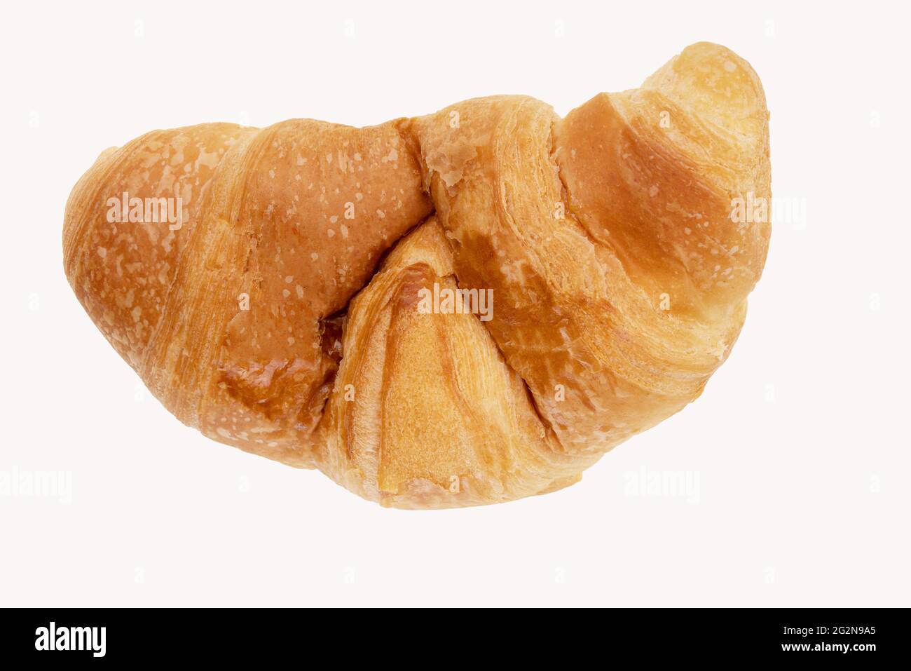 Delicious, fresh croissant on a white background from above. Croissant isolated. Stock Photo