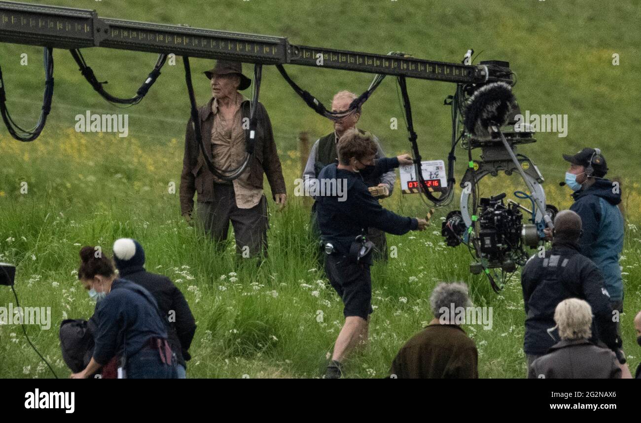 Leaderfoot Viaduct, Scottish Borders, UK. 11th June, 2021. UK. Harrison Ford, aka, Indiana Jones pictured on location with co star Toby Jones, filming scenes for the latest Indian Jones movie. Mist effects were used to create a dramatic scene as the sun broke through in the early evening. Credit: phil wilkinson/Alamy Live News Stock Photo