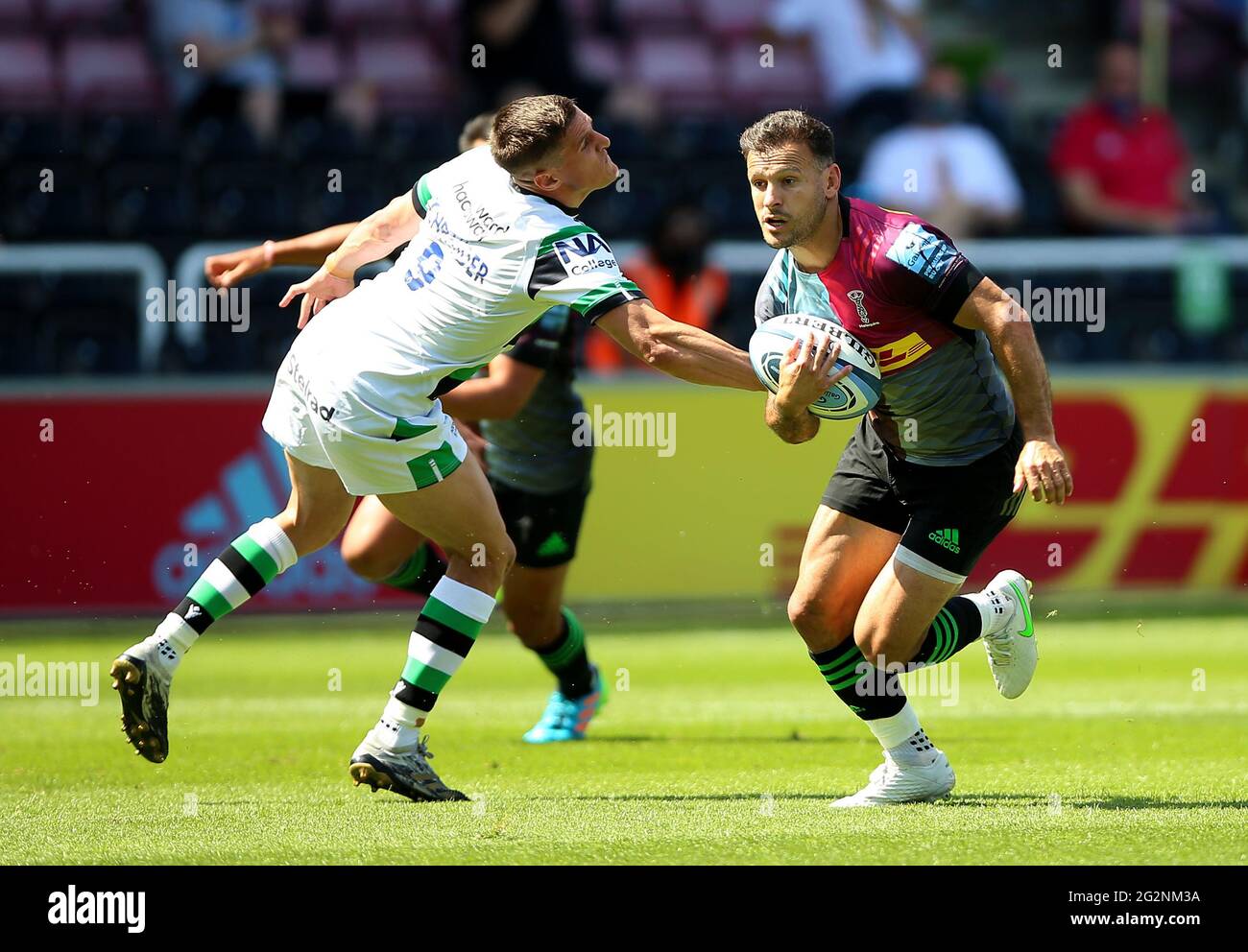 Harlequins' Danny Care evades a tackle from Newcastle Falcons' Louis Schreuder to score a try during the Gallagher Premiership match at Twickenham Stoop, London. Picture date: Saturday June 12, 2021. Stock Photo