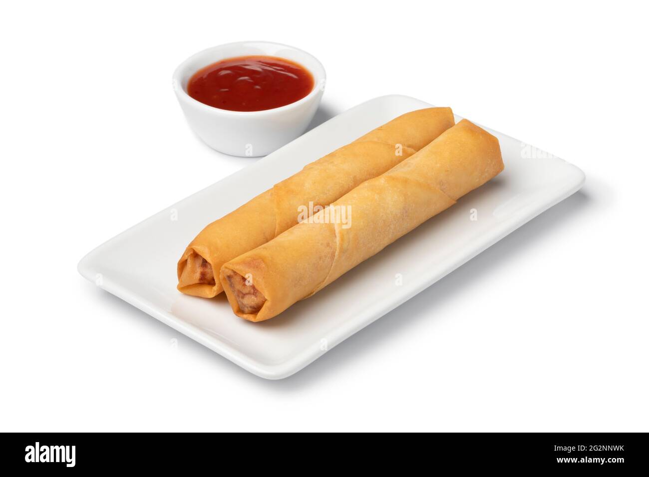 Plate with crispy deep fried Vietnamese egg rolls and sauce isolated on