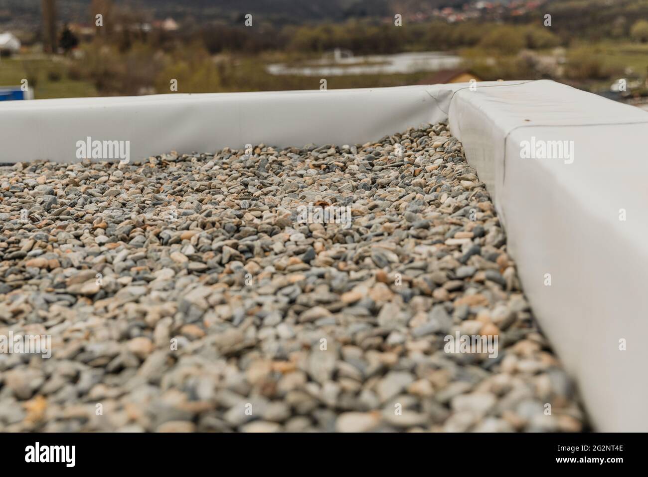 Closeup shot of crushed stone on the roof with blurred background Stock ...