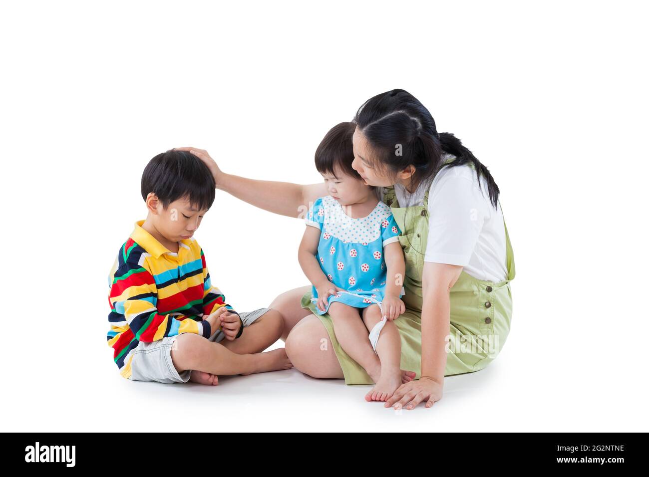 Image of mother with two little asian (thai) children (full body), daughter sitting on lap, son feel bad, mom comforting. Great parenting image. Probl Stock Photo