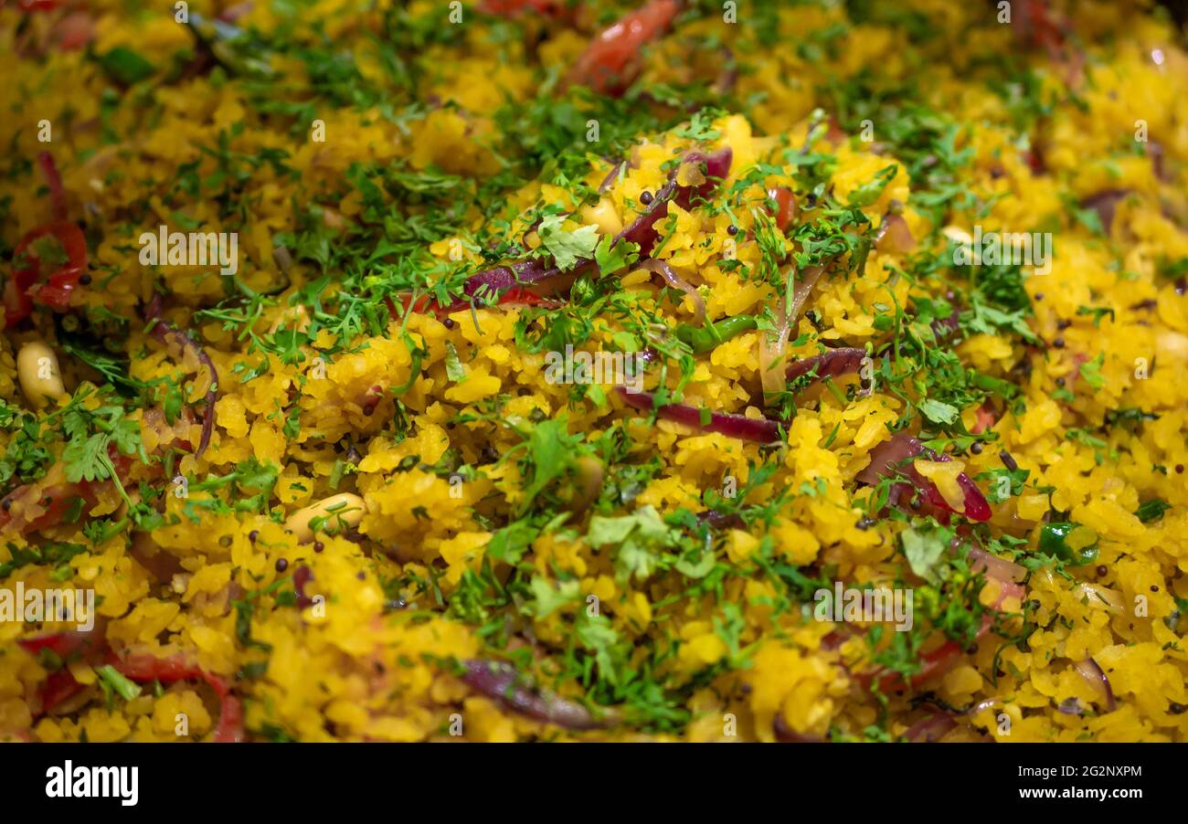 Indian Breakfast Dish Poha Also Know as Pohe or Aalu poha made up of Beaten Rice or Flattened Rice. Popular Maharashtrian breakfast recipe. Stock Photo