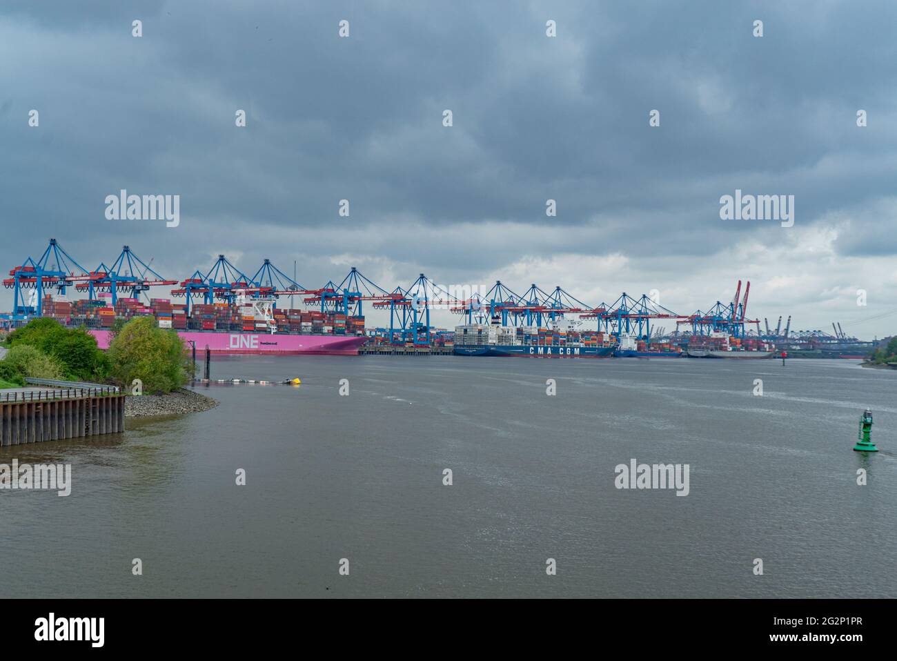 Port of Hamburg with its huge container cranes - CITY OF HAMBURG, GERMANY - MAY 10, 2021 Stock Photo