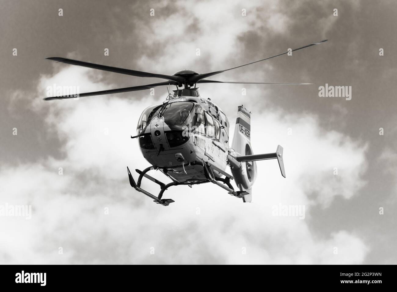 ÖAMTC-Flugrettung Christophorus 2 - a monochrome of the 2nd emergency medical helicopter in Austria, taking off for a medical emergency. Lower Austria Stock Photo