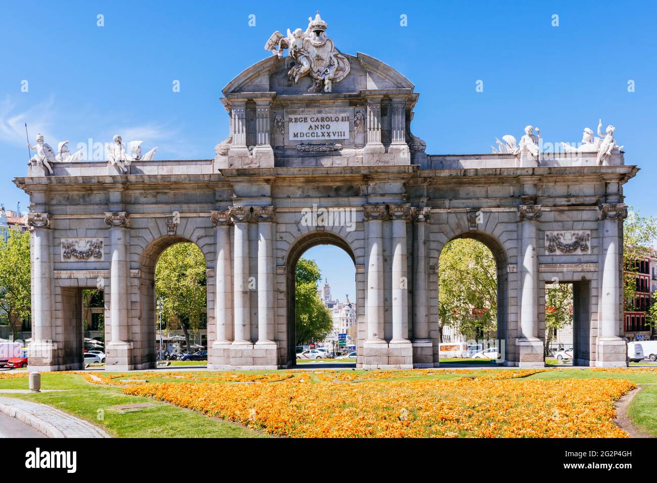 East side. The Puerta de Alcalá is one of the five old royal gates that gave access to the city of Madrid, is a Neo-classical gate in the Plaza de la Stock Photo