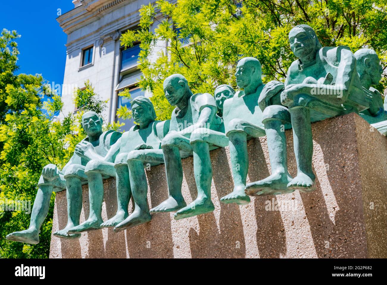 Refugiados, Refugees, is a monument and instance of public art in Madrid. Located at a water pond of the Paseo de Recoletos, it is dedicated to migran Stock Photo