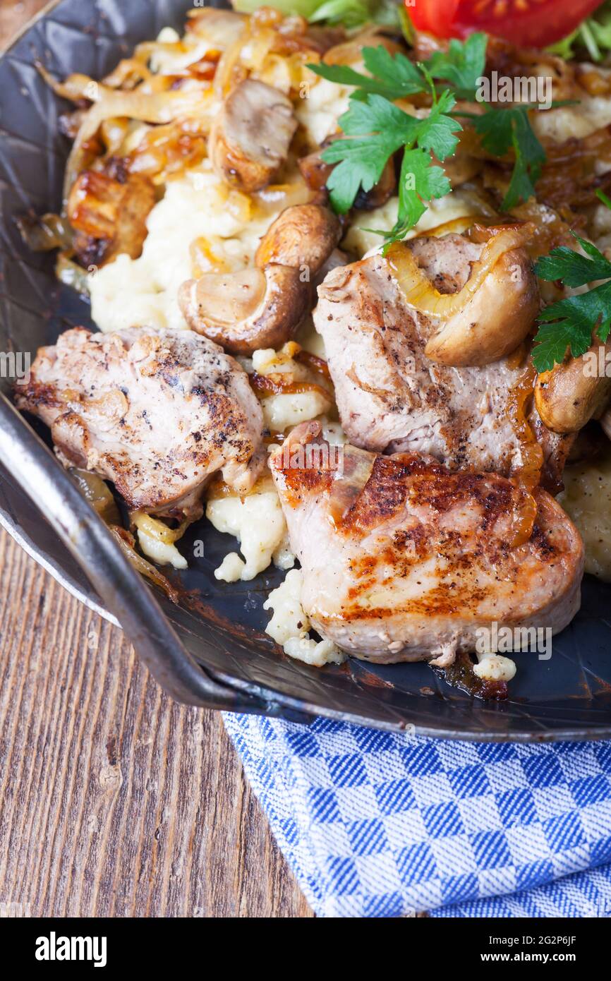 pork fillet on spaetzle with mushrooms Stock Photo Alamy