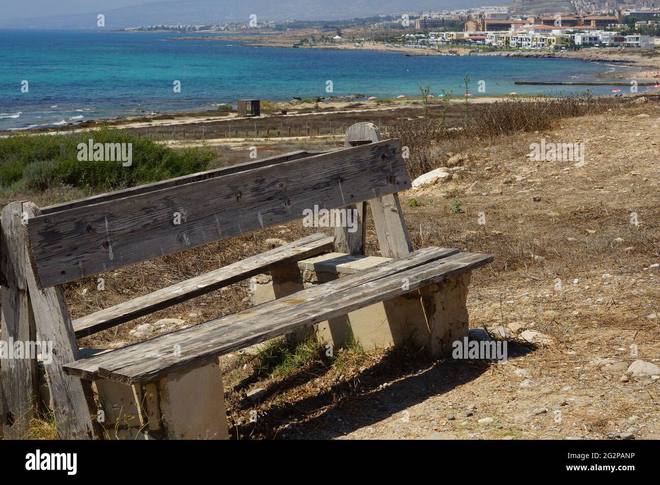 Closeup shot of a wooden bench close to the coast in Cyprus Stock Photo ...