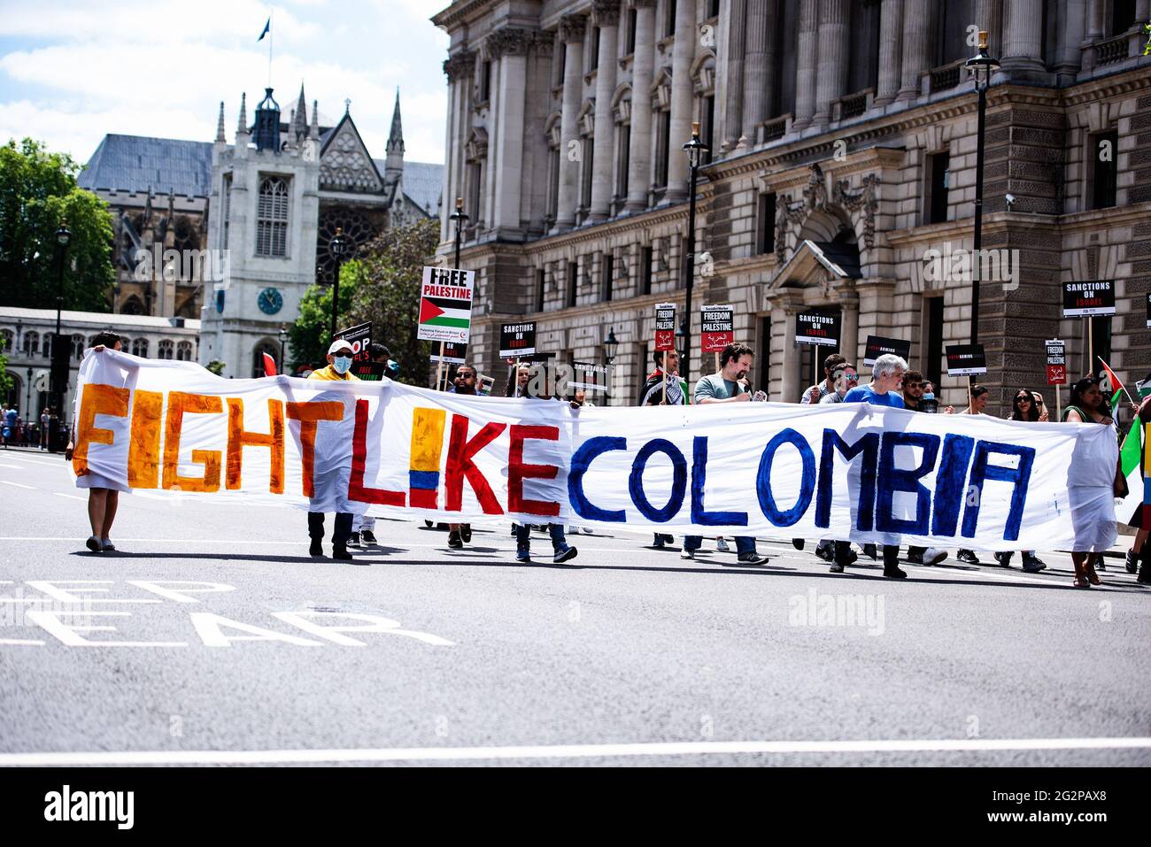London Uk 12th June 21 Protesters March Along Whitehall While Holding A Large Banner Saying Fight Like Colombia During A Demonstration Demanding Justice For Palestine Since May 21 Israel Launched 11 Day Aerial