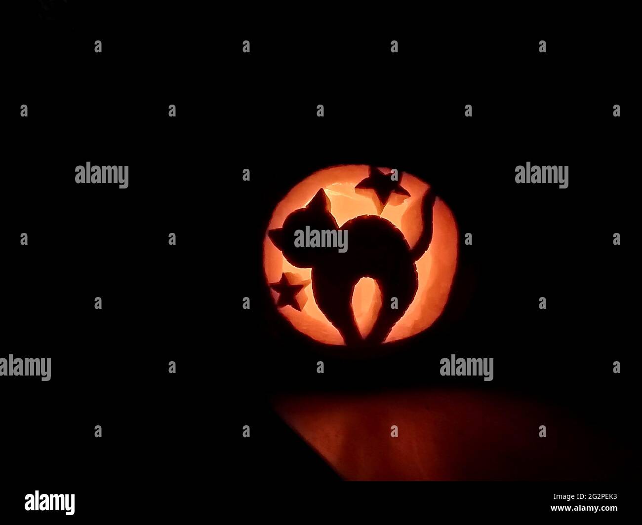 Halloween carved pumpkin glowing in the dark Stock Photo - Alamy