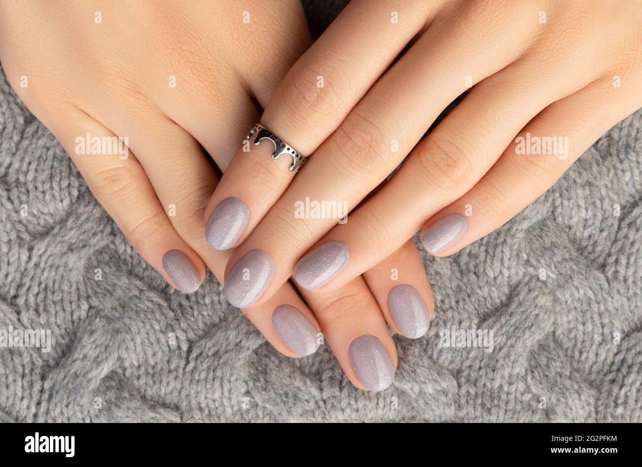 Beautiful womans hands with trendy nail design on gray knitted background  Stock Photo - Alamy